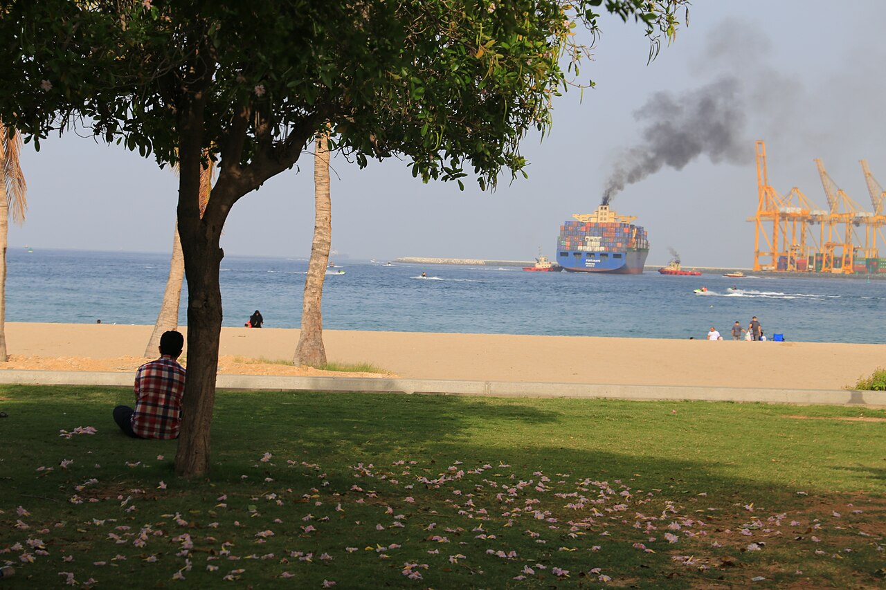 Khor Fakkan container port on 7 April 2017: historical contextual photograph with commercial shipping and assisting tugs; not an image of the 18 October 2026 attack.